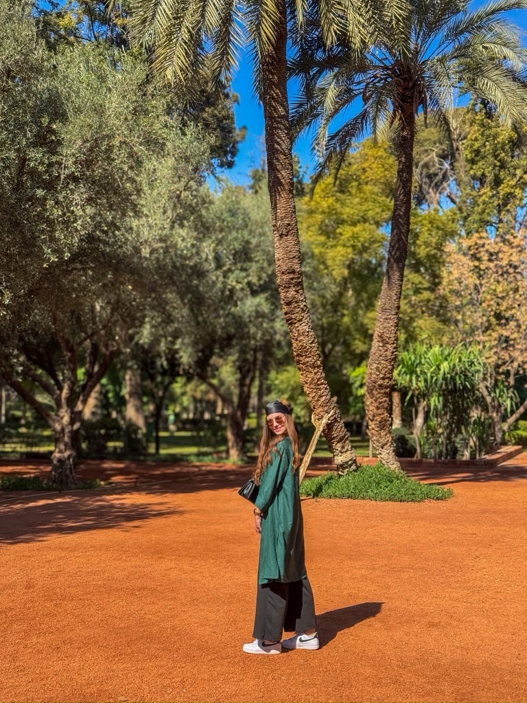 A women standing in the gardens of the Cyber Parc in Marrakech.